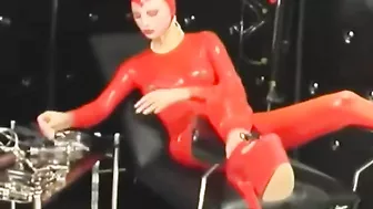 Sexy Girl Encased In Red Rubber Catsuit Loves Medical Games With Mouth Spreader And Nipple Clamps