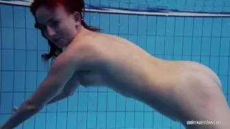 A Redhead Girl Having Fun In The Pool