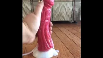 Giving A Handjob To A Cumming Dragon Dildo